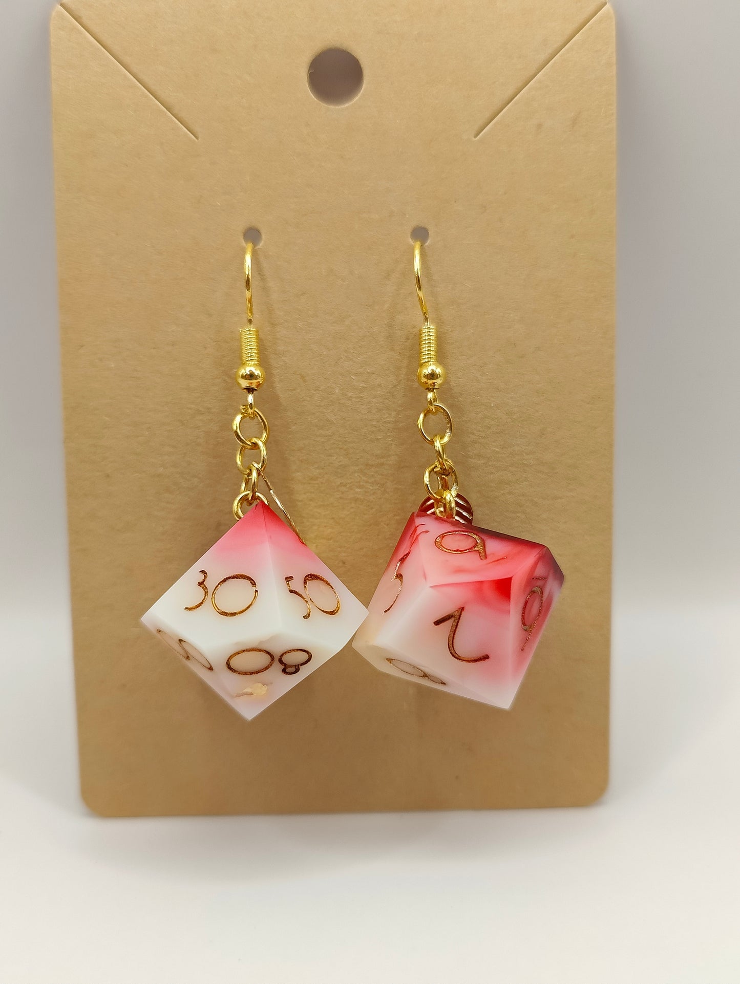 Handmade dangly D10/D% earrings: Inflict wounds