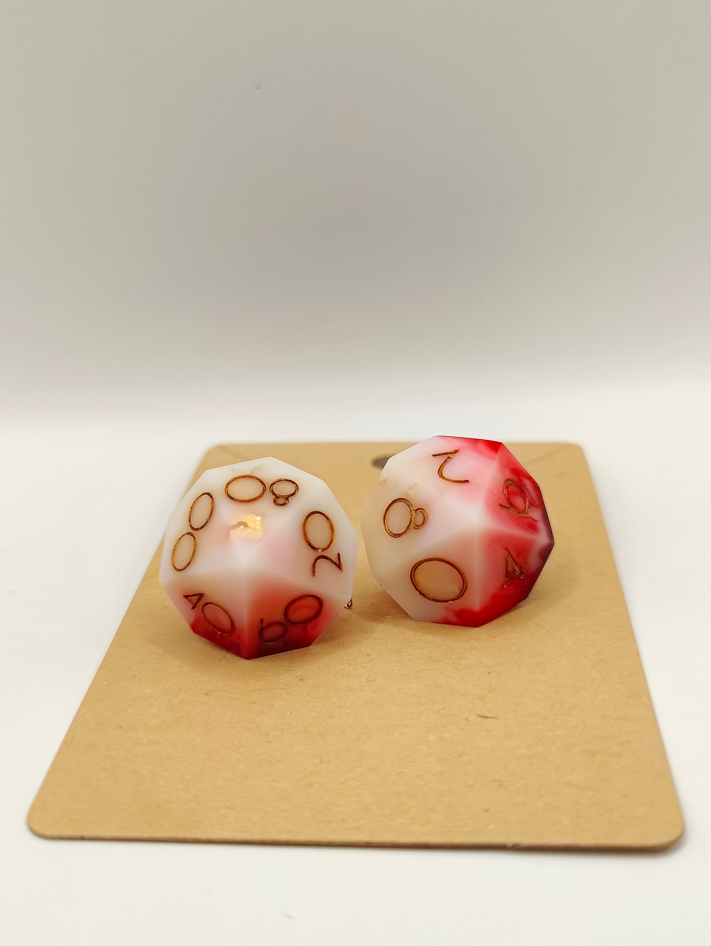 Handmade dangly D10/D% earrings: Inflict wounds