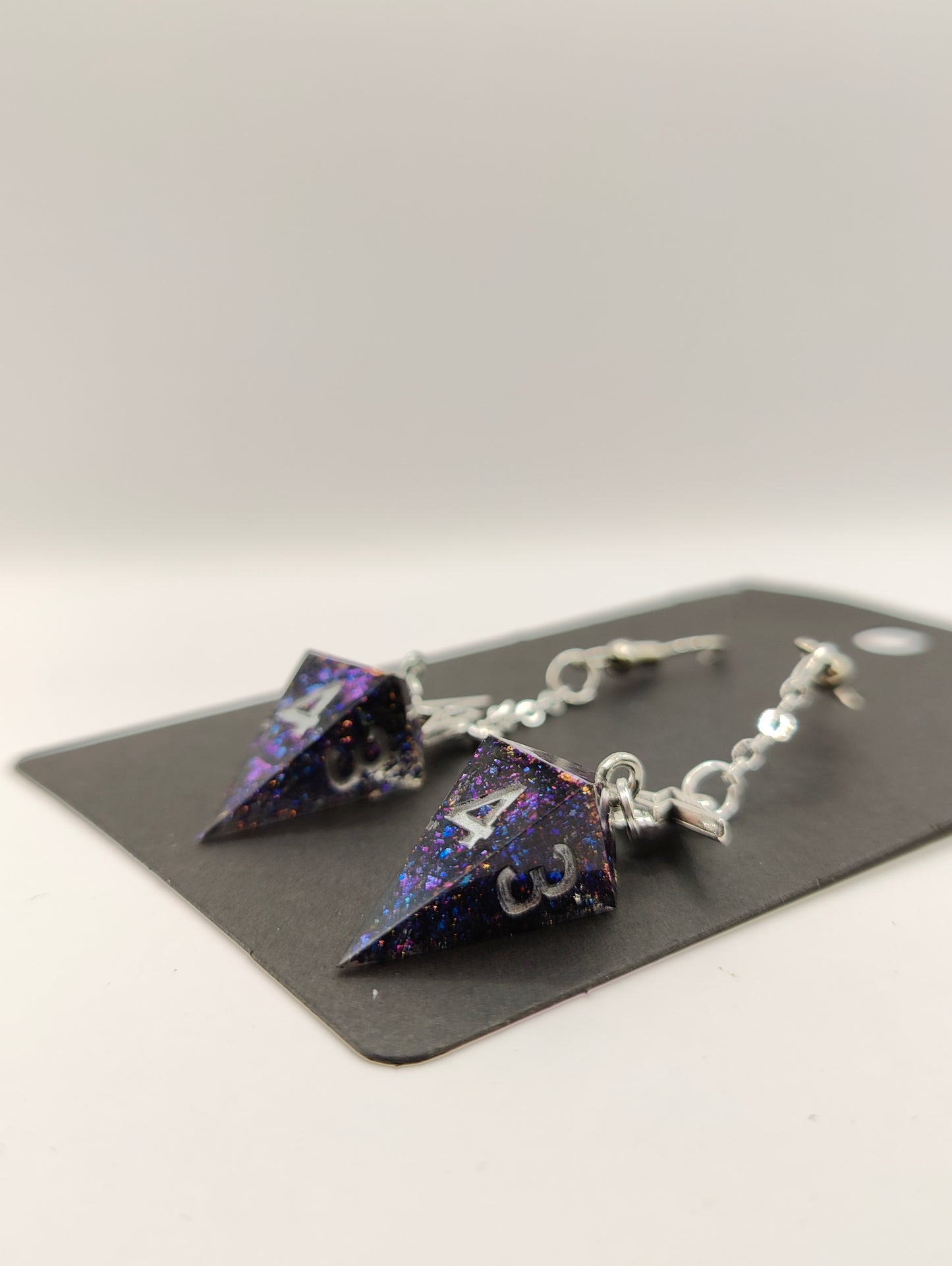 Handmade dangly mini D4 earrings: Shifting galaxies